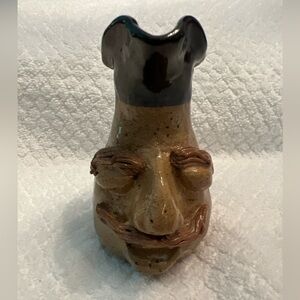 - Small face pitcher pottery by artist John La Boone  4.5 inches